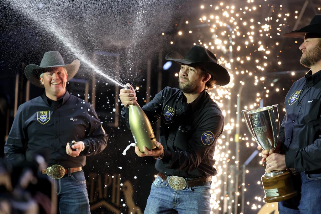 Casey Deary, Adan Banuelos, and Clayton Edsall celebrate their victories during The American Performance Horseman by Teton Ridge at Globe Life Field on March 08, 2024 in Arlington, Texas.