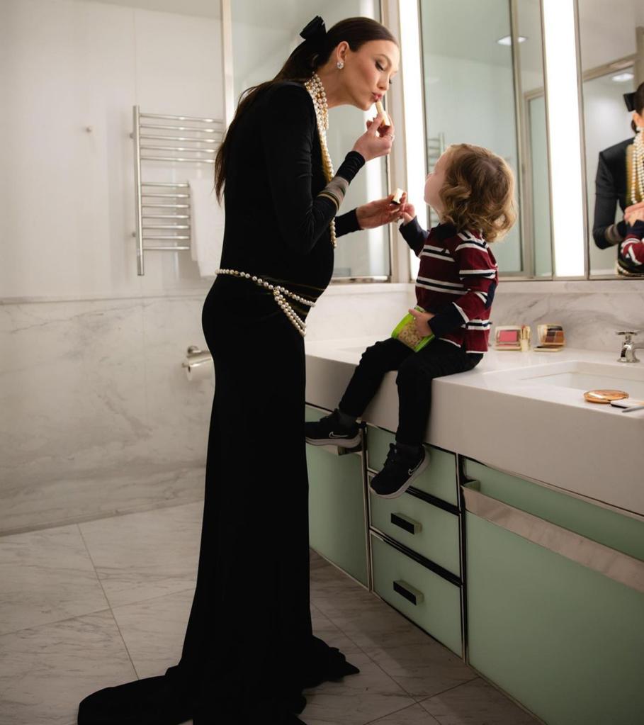 Karlie Kloss with her son Levi in a bathroom. 